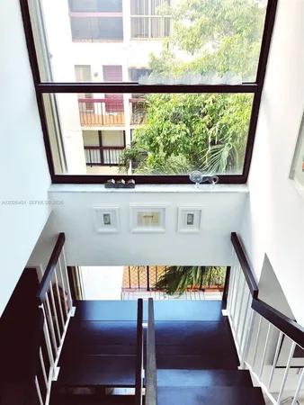 a view of a balcony with chairs