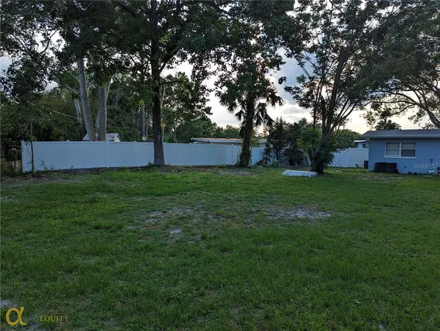 a view of a tree in front of a house