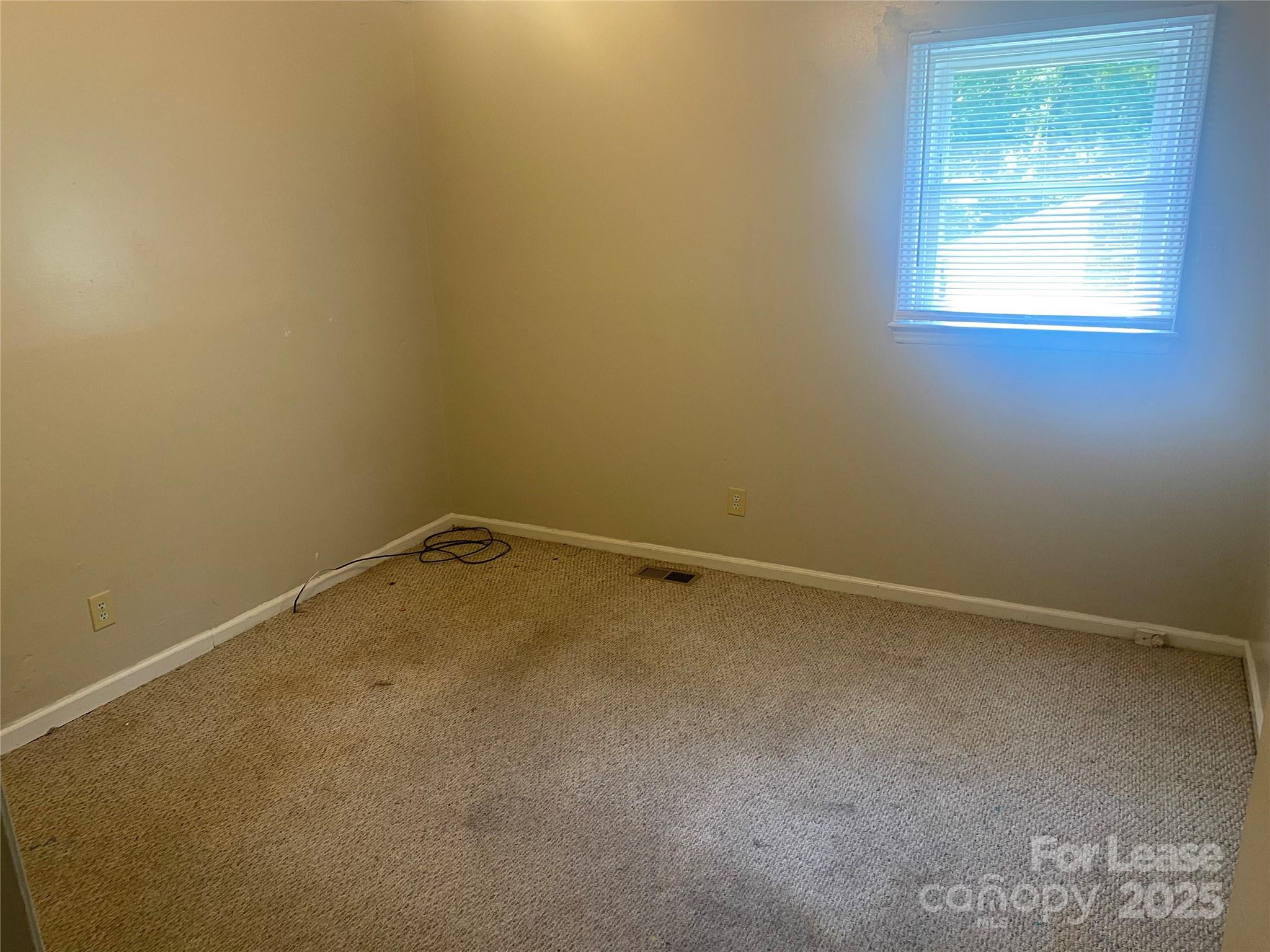 1427 Oak Hill Drive Morganton, NC 28655 - Photo 7 of 12 an empty room with a window