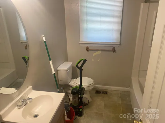 a bathroom with a sink and a toilet