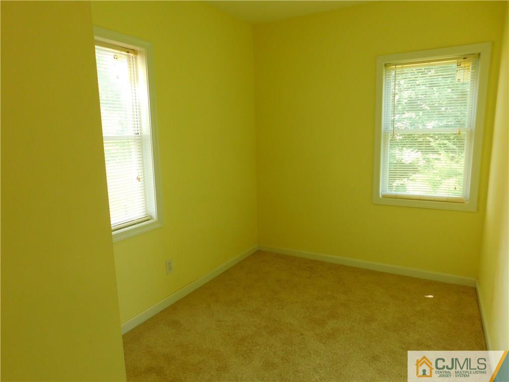 464 Harding Road Old Bridge, NJ 08879 - Photo 7 of 12 a view of a blue wall with a window