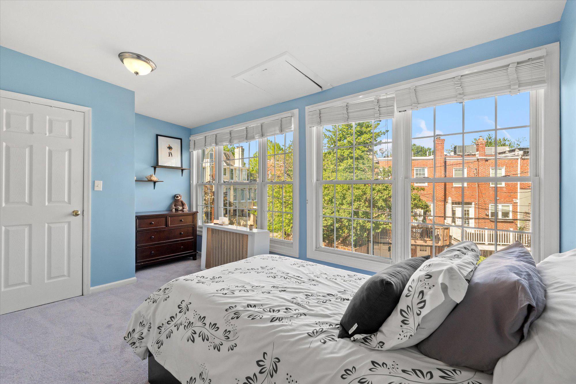 2305 38th Street Northwest Washington, DC 20007 - Photo 22 of 38 a bedroom with a bed and wooden floor
