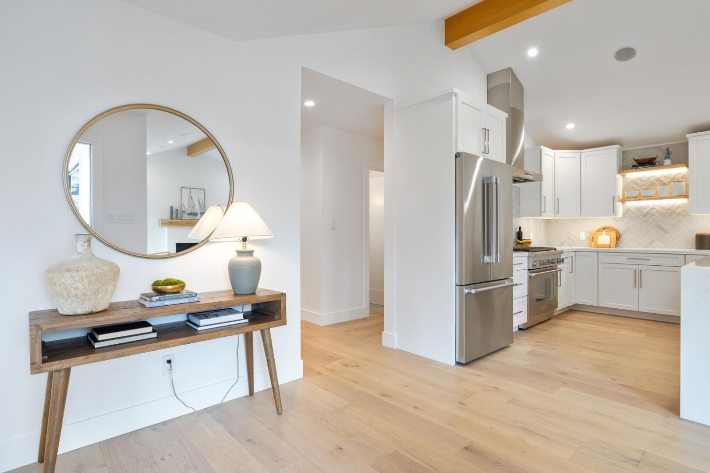 3130 Pico Avenue Carmel, CA 93923 - Photo 13 of 54 a kitchen with stainless steel appliances granite countertop a refrigerator a stove and a sink