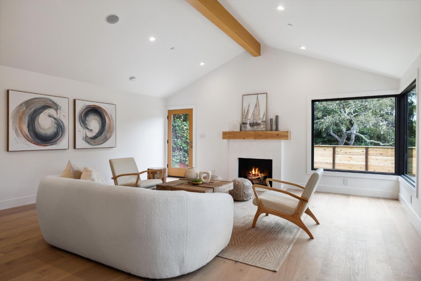 3130 Pico Avenue Carmel, CA 93923 - Photo 15 of 54 a living room with furniture a fireplace and a large window