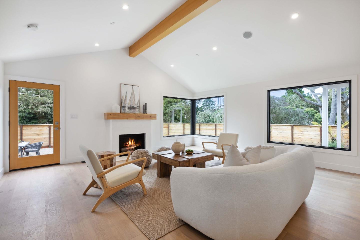 3130 Pico Avenue Carmel, CA 93923 - Photo 17 of 54 a living room with furniture a fireplace and a large window