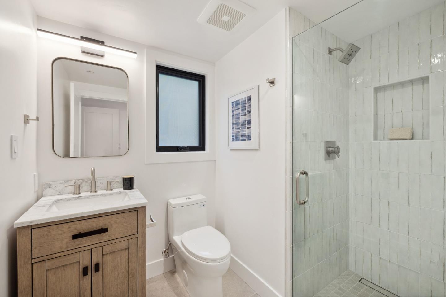 3130 Pico Avenue Carmel, CA 93923 - Photo 43 of 54 a bathroom with a toilet sink and mirror