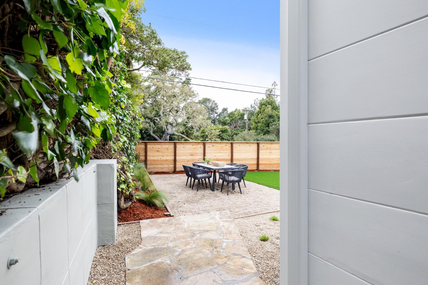 3130 Pico Avenue Carmel, CA 93923 - Photo 48 of 54 a view of a patio with table and chairs and potted plants