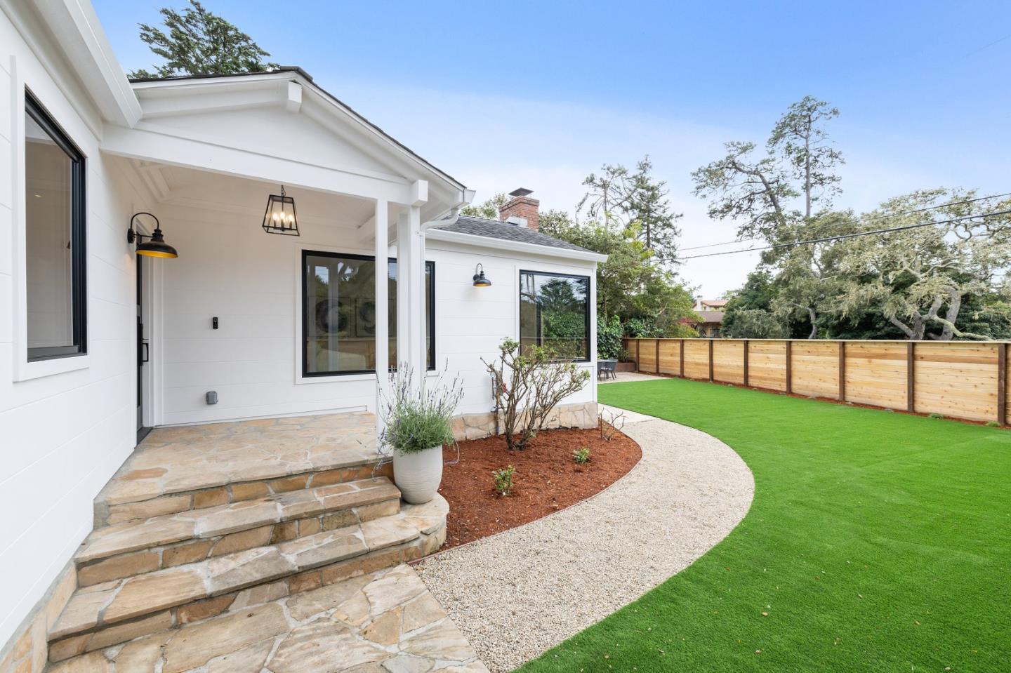 3130 Pico Avenue Carmel, CA 93923 - Photo 9 of 54 a view of a house with backyard porch and sitting area