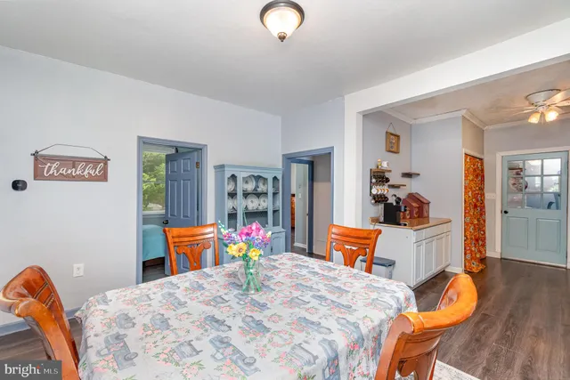 a bedroom with furniture and a wooden floor
