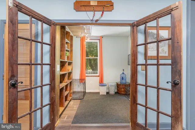 a view of a livingroom with furniture and a flat screen tv