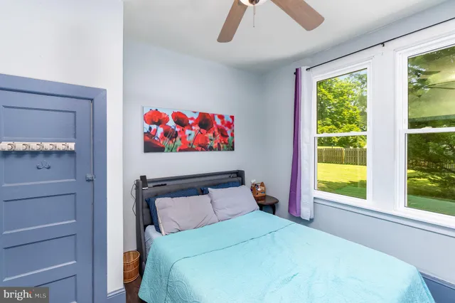 a bedroom with furniture and flat screen tv