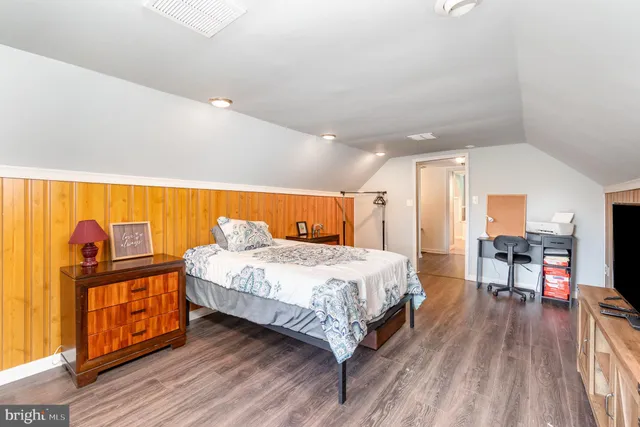 a view of a livingroom with furniture hardwood floor and staircase