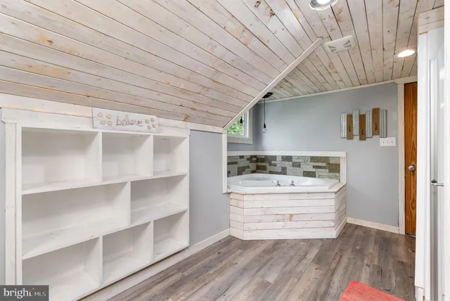 a bathroom with a bathtub and shower