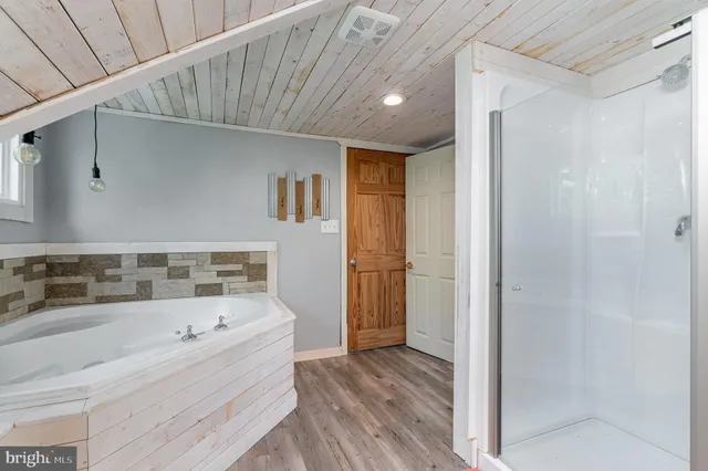 a view of swimming pool with outdoor seating and trees