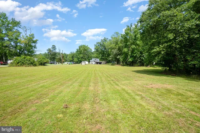 a picture of a wall with a white bed