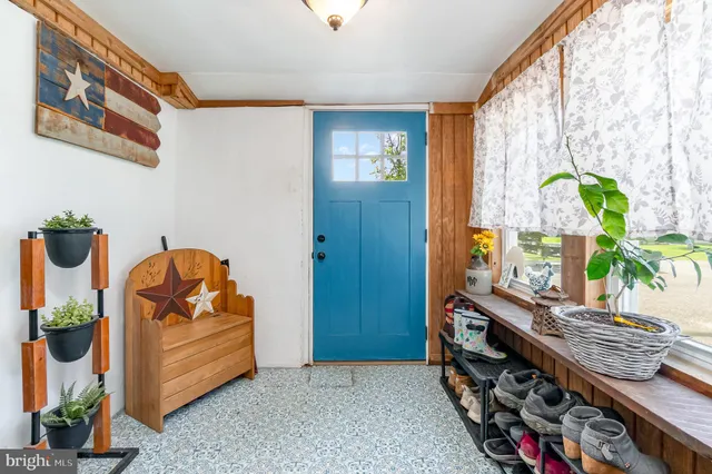 a view of an entryway with wooden floor