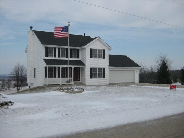 14577 Laube Road Durand, IL 61024 - Photo 1 of 24 a front view of a house with a slide