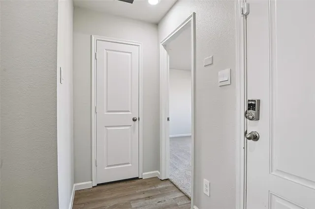 a view of a bathroom with wooden floor