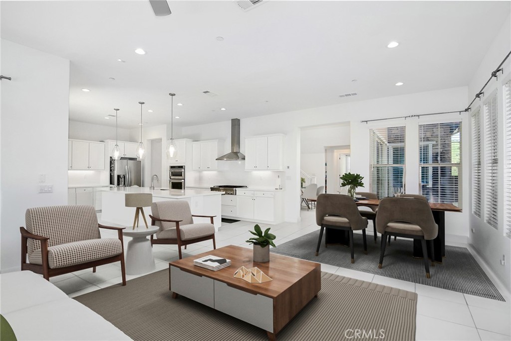 24336 Sterling Ranch Road West Hills, CA 91304 - Photo 13 of 40 a living room with furniture kitchen view and a large window