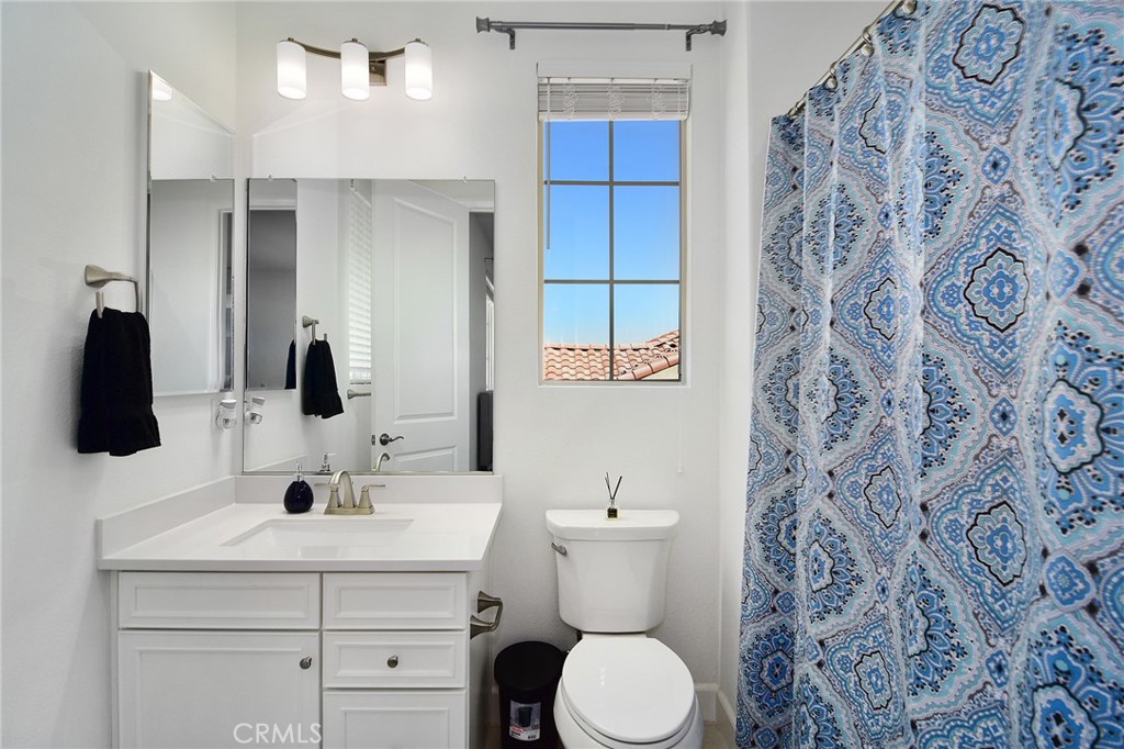 24336 Sterling Ranch Road West Hills, CA 91304 - Photo 27 of 40 a bathroom with a sink and a mirror