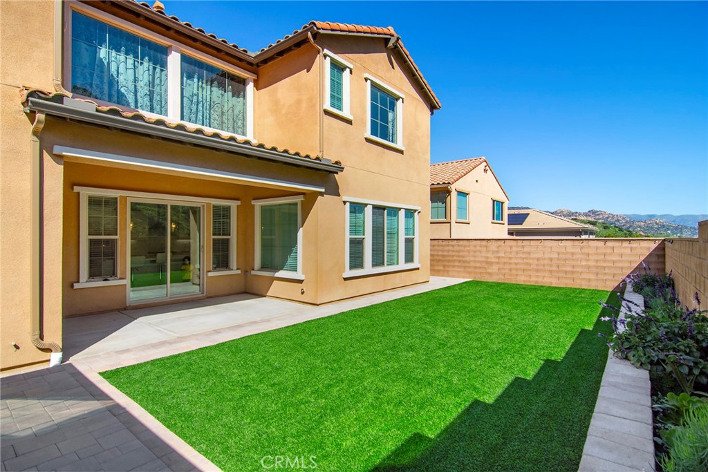 24336 Sterling Ranch Road West Hills, CA 91304 - Photo 34 of 40 a front view of a house with a yard and porch