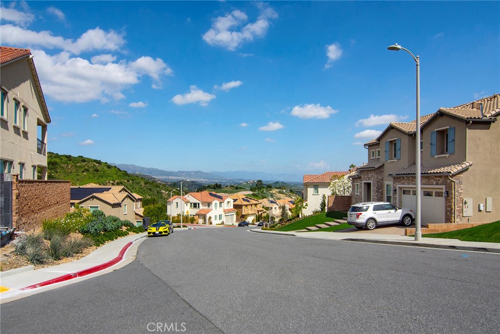 24336 Sterling Ranch Road West Hills, CA 91304 - Photo 39 of 40 a view of a street with cars