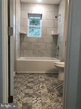 538 Newcomb Street Southeast Washington, DC 20032 - Photo 14 of 29 a bathroom with a bathtub and a shower