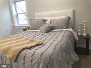 538 Newcomb Street Southeast Washington, DC 20032 - Photo 18 of 29 a bedroom with a bed and window