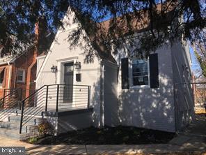 538 Newcomb Street Southeast Washington, DC 20032 - Photo 26 of 29 a front view of a house with a tree
