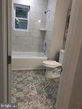538 Newcomb Street Southeast Washington, DC 20032 - Photo 28 of 29 a bathroom with a toilet and a shower