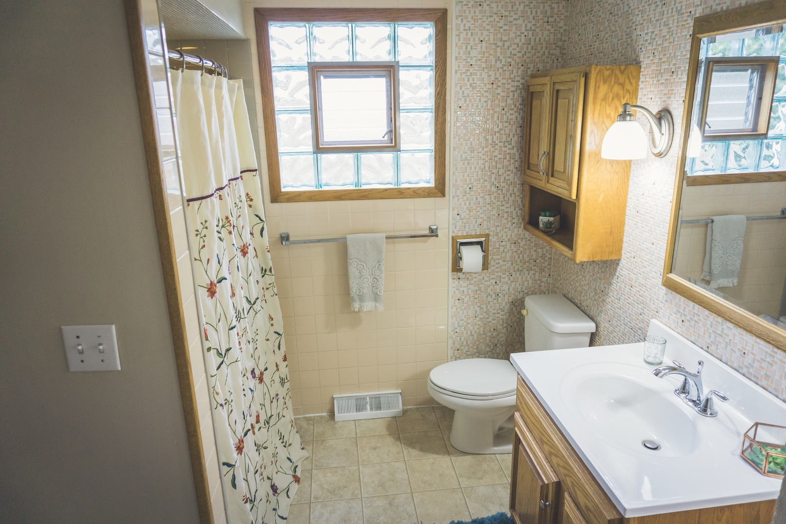 28939 May Street Spring Grove, IL 60081 - Photo 12 of 28 a bathroom with a sink toilet and shower