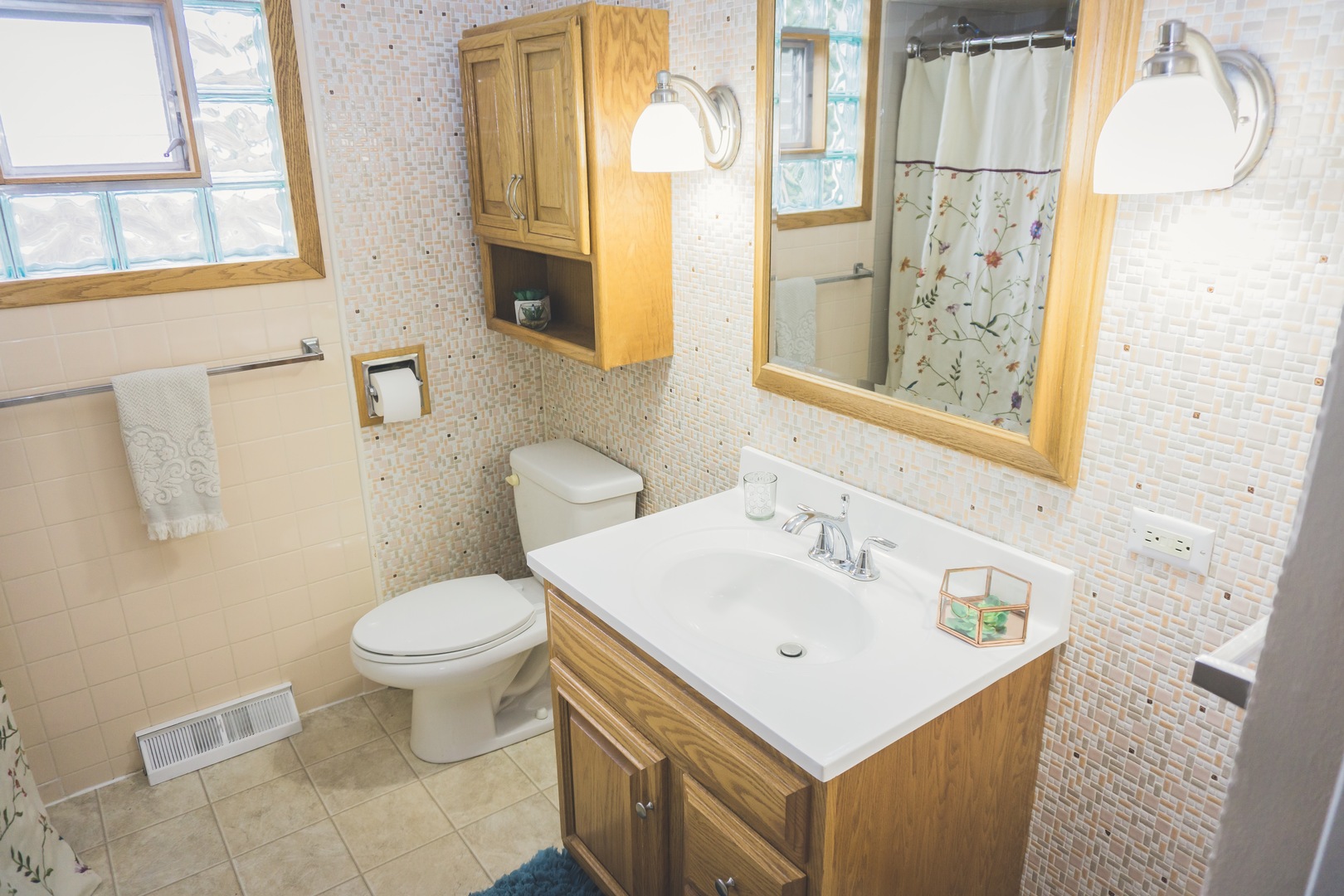 28939 May Street Spring Grove, IL 60081 - Photo 22 of 28 a bathroom with a sink mirror and a toilet