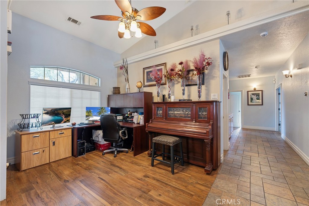 7172 Jargon Road Hesperia, CA 92344 - Photo 8 of 75 a view of a workspace with furniture and a kitchen