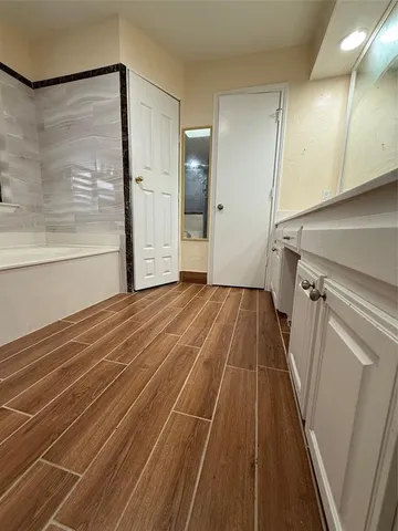 a view of a room with wooden floor and staircase