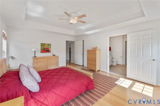 a bed room with a bed and a chandelier