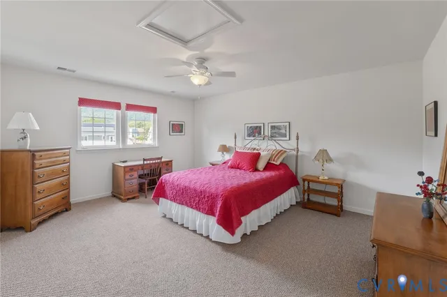 a bed room with a bed and a chandelier
