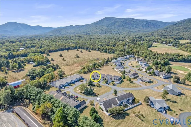 an aerial view of a house with a garden