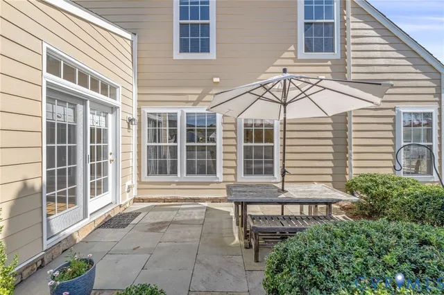 a view of a building with a window and sitting area