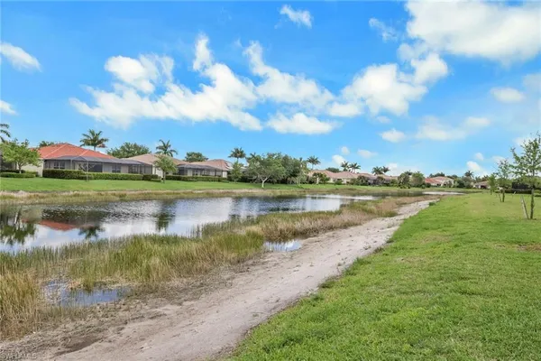a view of a lake with a yard