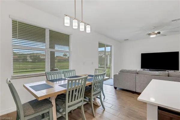 a view of a livingroom with furniture and a flat screen tv