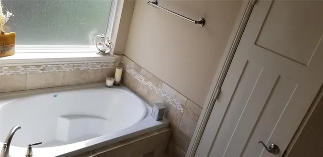 a view of a bathtub in a bathroom