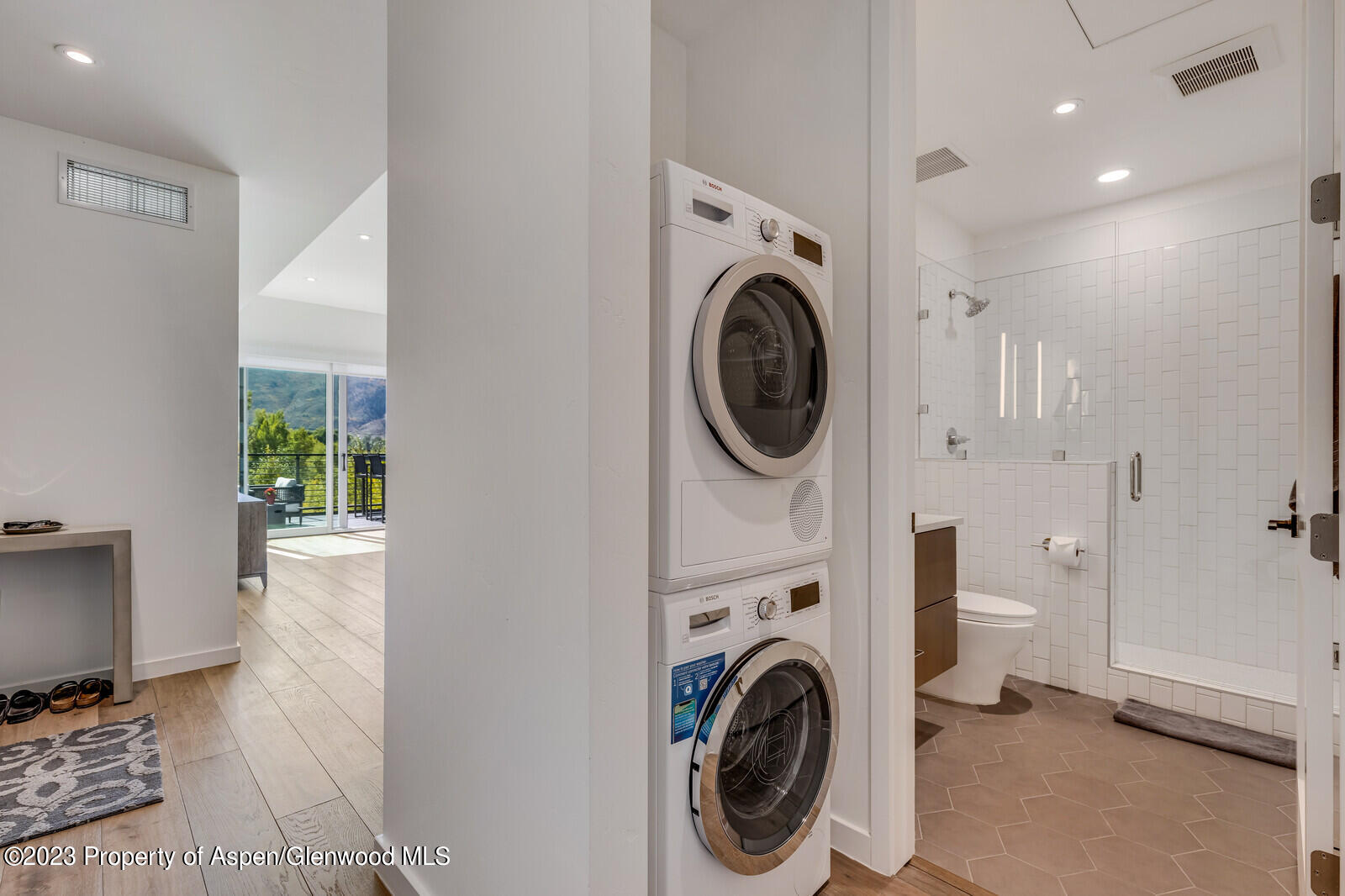 22860 2 Rivers Road, Unit 370 Basalt, CO 81621 - Photo 11 of 27 a view of a hallway with washer and dryer