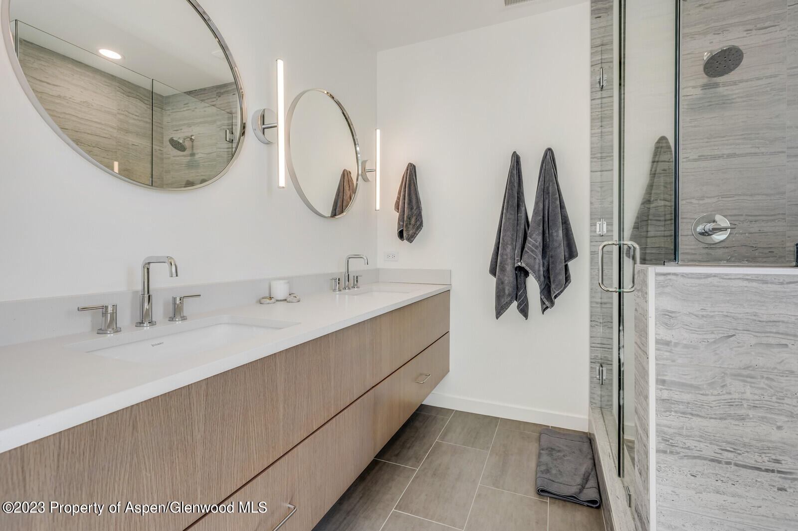 22860 2 Rivers Road, Unit 370 Basalt, CO 81621 - Photo 14 of 27 a bathroom with a double vanity sink and a mirror