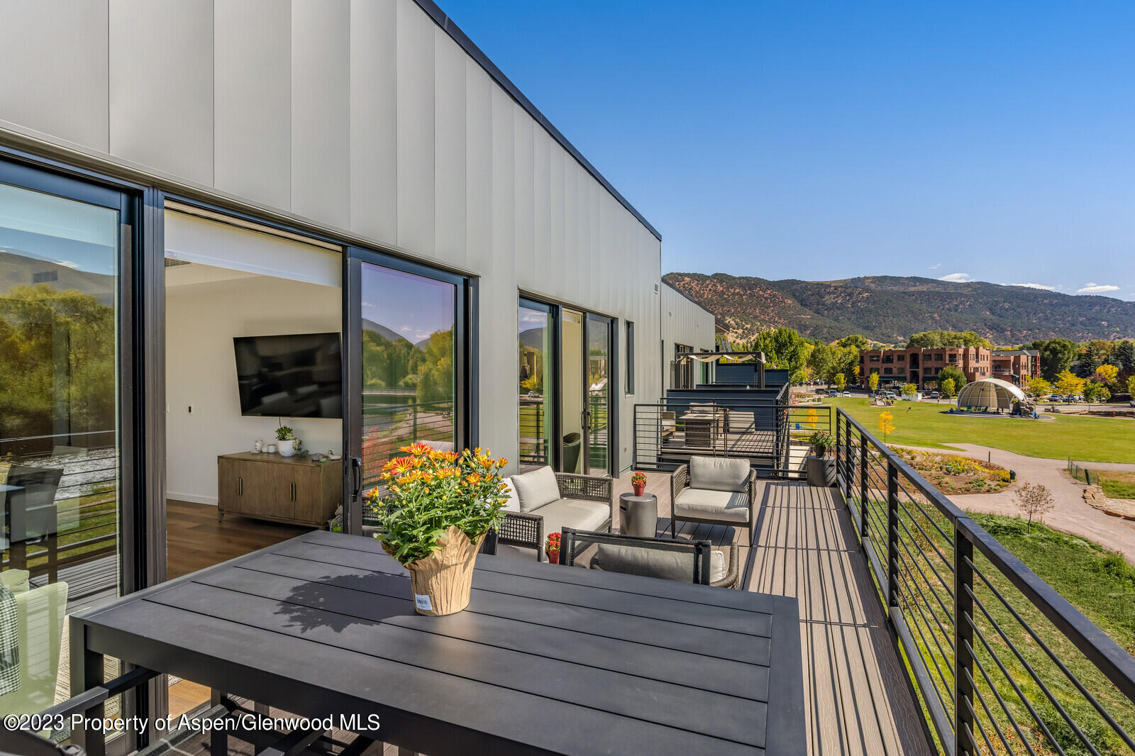 22860 2 Rivers Road, Unit 370 Basalt, CO 81621 - Photo 18 of 27 a view of a balcony with chair and wooden floor