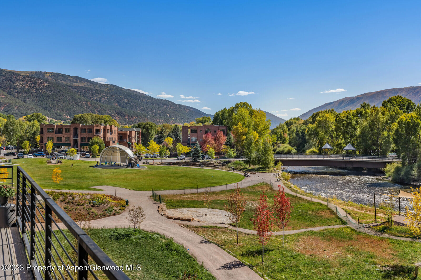 22860 2 Rivers Road, Unit 370 Basalt, CO 81621 - Photo 19 of 27 a view of a swimming pool with a yard and outdoor seating