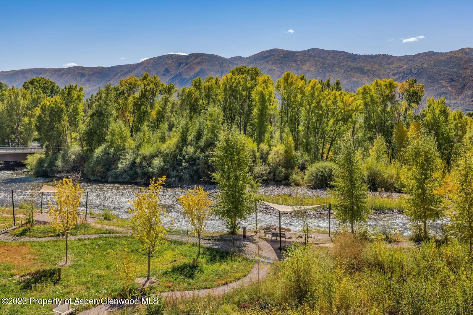 22860 2 Rivers Road, Unit 370 Basalt, CO 81621 - Photo 20 of 27 a view of a lake with a mountain