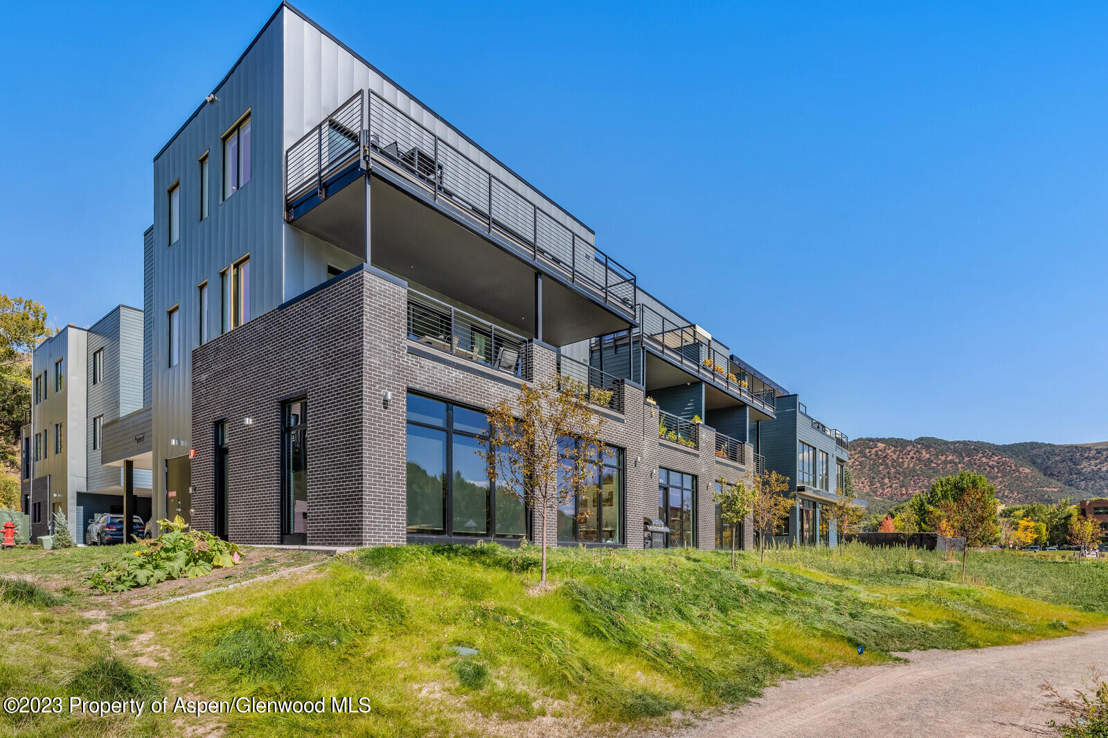 22860 2 Rivers Road, Unit 370 Basalt, CO 81621 - Photo 21 of 27 a view of a building with a yard