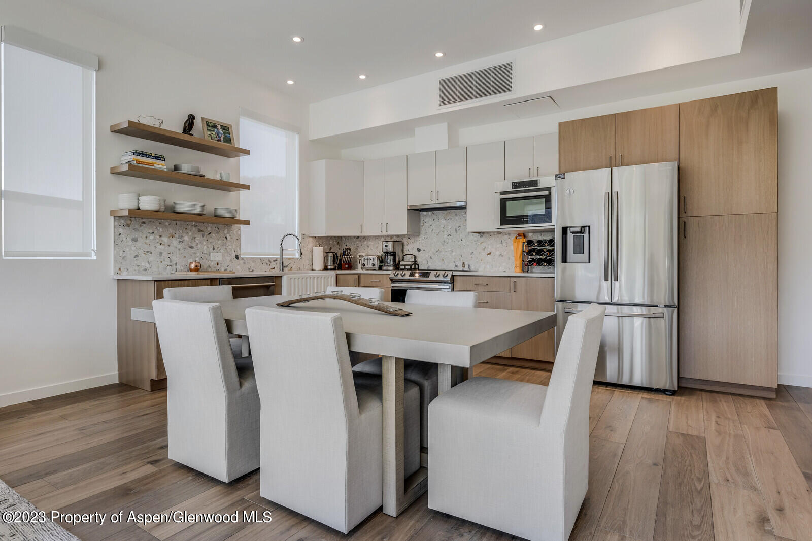 22860 2 Rivers Road, Unit 370 Basalt, CO 81621 - Photo 6 of 27 a kitchen with stainless steel appliances a refrigerator a stove a sink and a center island