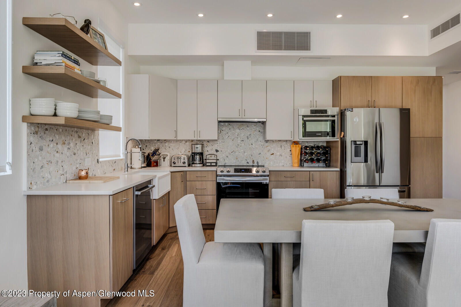 22860 2 Rivers Road, Unit 370 Basalt, CO 81621 - Photo 7 of 27 a kitchen with a sink a counter top space stainless steel appliances and cabinets