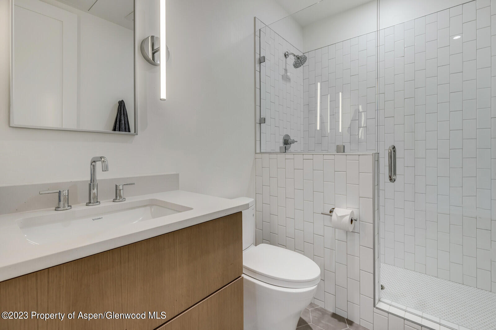 22860 2 Rivers Road, Unit 370 Basalt, CO 81621 - Photo 10 of 27 a bathroom with a granite countertop sink a toilet and shower